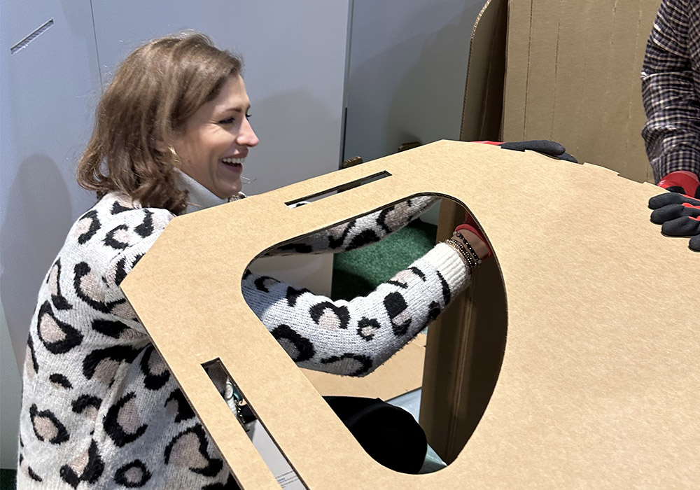 Cardboard booth set-up with eco-friendly message.
