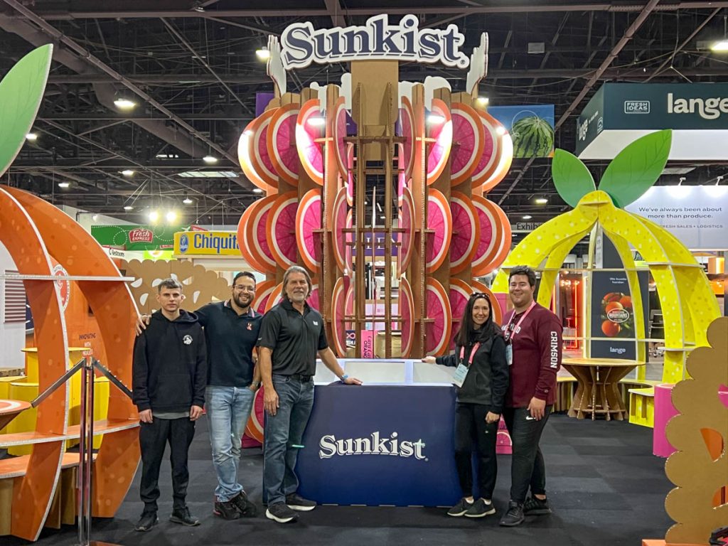The staff of the Sunkist booth, posing at the beginning of the fair.
