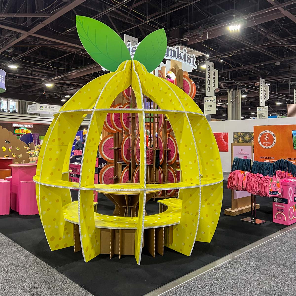 Lemon-shaped gathering area designed in cardboard.